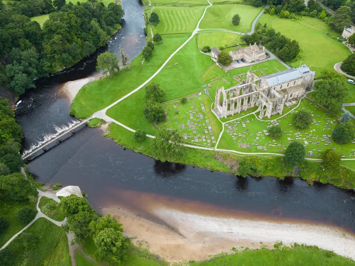 A wide angle shot of Bolton Abbey and surrounding lands taken by drone 