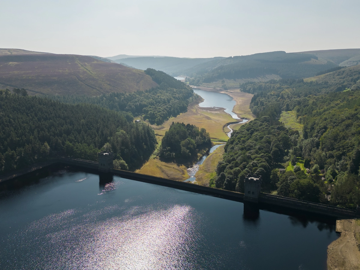 An ariel drone shot of Howden Resevoir  looking down towards Derwent Resevoir on a sunny day.