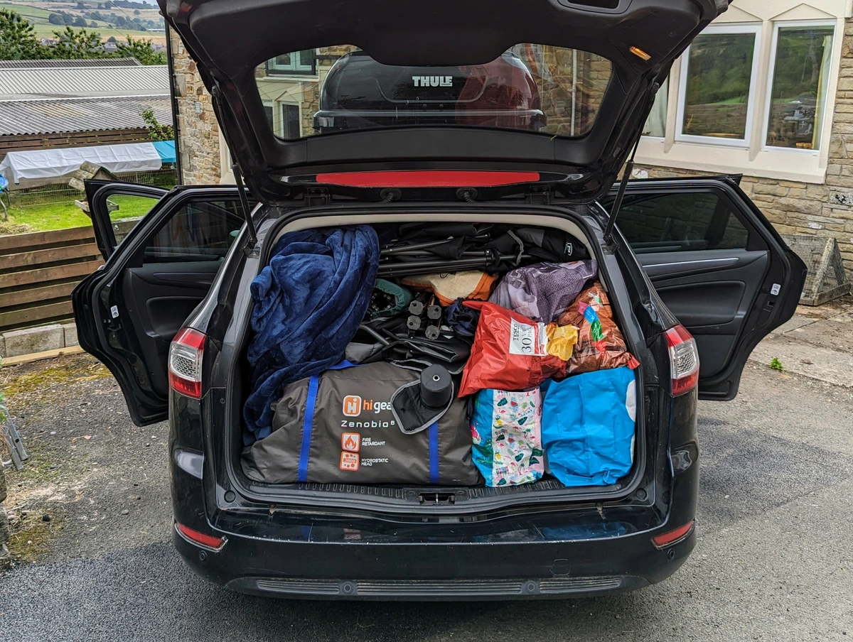 tips for stress-free travel with children - when you pack the car for a road trip make sure you can reach the snacks!