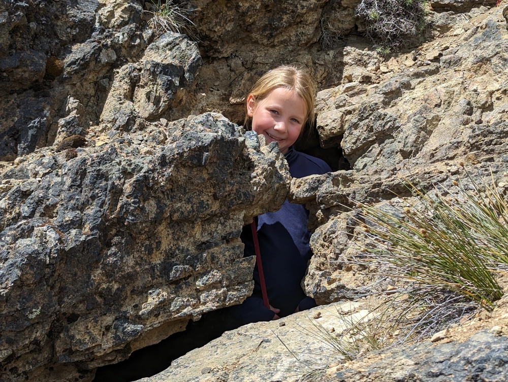 Eva exploring an old puma cave in Monumento Natural Dos Lagunas