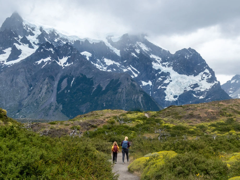 People walking on a trail towards Cerro Paine view point in Torres del Paine National Park 