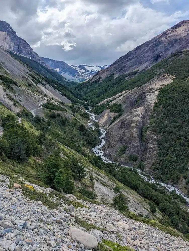 A river running down Windy Pass with mountains in the background in Torres del Paine National Park