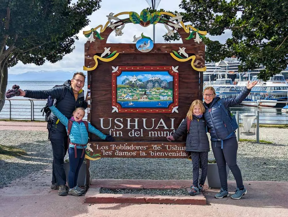 The Spencer family posing in front of the 'end of the world' sign in Ushuaia