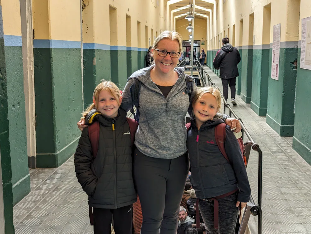 Kirsty and the girls posing in one of the corridors of the prison museum in Ushuaia