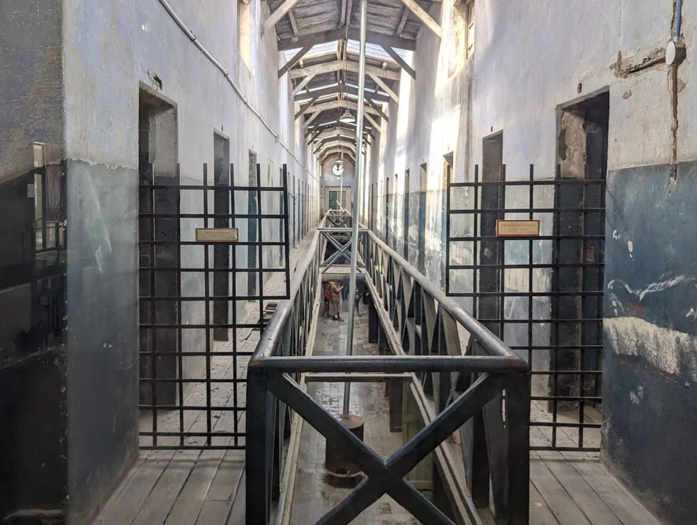 A view down a prison wing in its original state at the Prison Museum in Ushuaia with cell doors down each side
