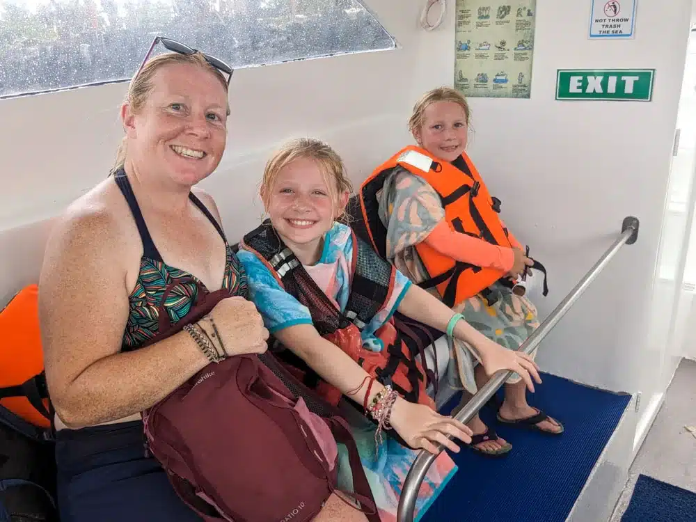Kirsty, Georgia and Eva sat in a row on the water taxi still in their beach gear looking slightly bedraggled